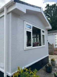 Modern park home with large window. fascia and guttering