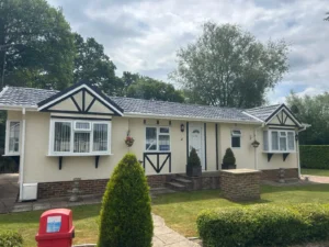 Charming bungalow style park home with landscaped garden after being repainted.