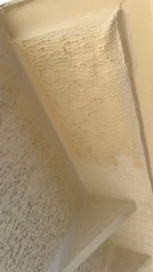 Textured ceiling with light colour and water leak